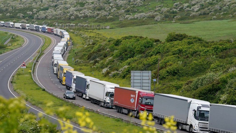 Lorries queue for the Port of Dover along the A20 in Kent as the getaway for half term and the bank holiday weekend begins