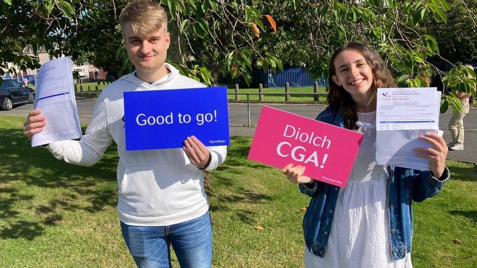 Two students at Gower College celebrating their results