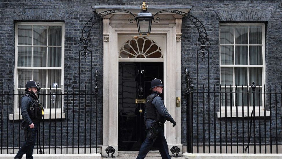 Police walking outside Downing Street