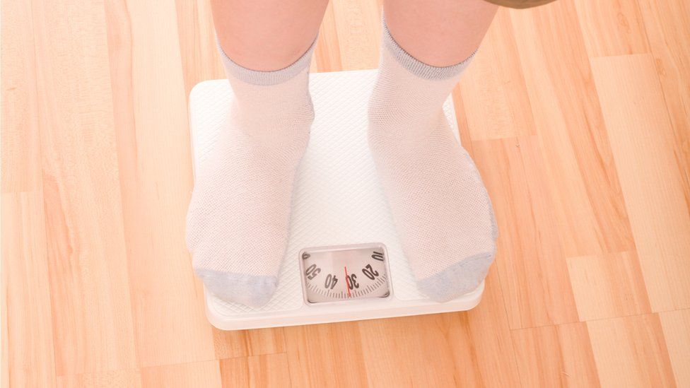 Child's feet on scales