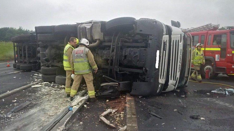 Offal lorry crash causes delays on M40 BBC News