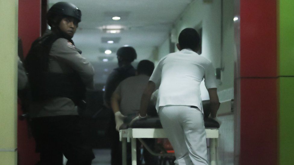 armed police securing a corridor of a hospital in Medan, North Sumatra province, after they shot dead one of two terror suspects during gun fighting on May 15 2018