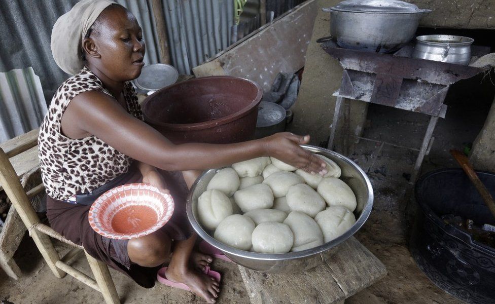 A woman prepares fufu, made from pounded cassava, in Monrovia, Liberia - Saturday 19 June 2021
