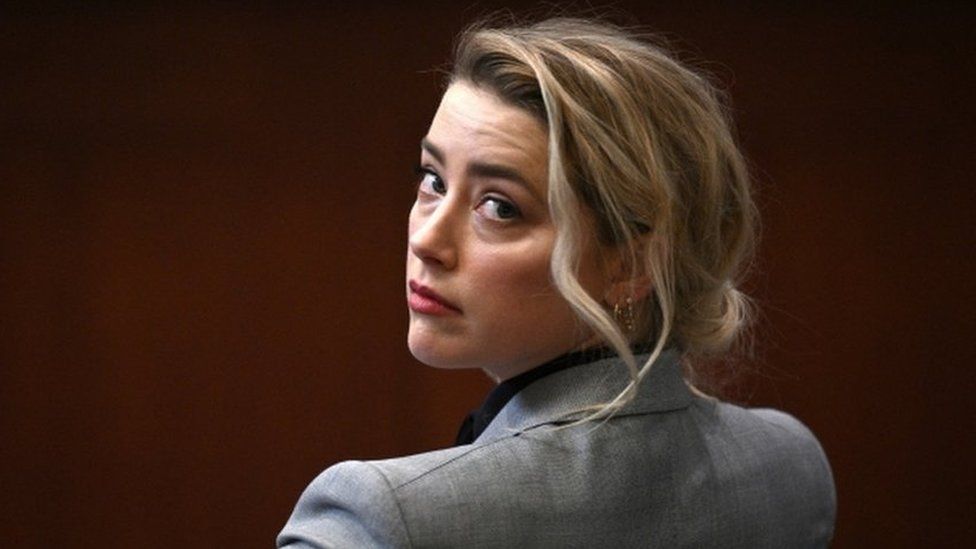 Amber Heard sits in a Virginia court for the start of her defamation trial against Johnny Depp