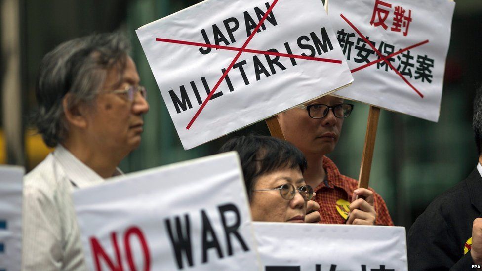 Activists outside the Japanese consulate in Hong Kong on 14 August 2015