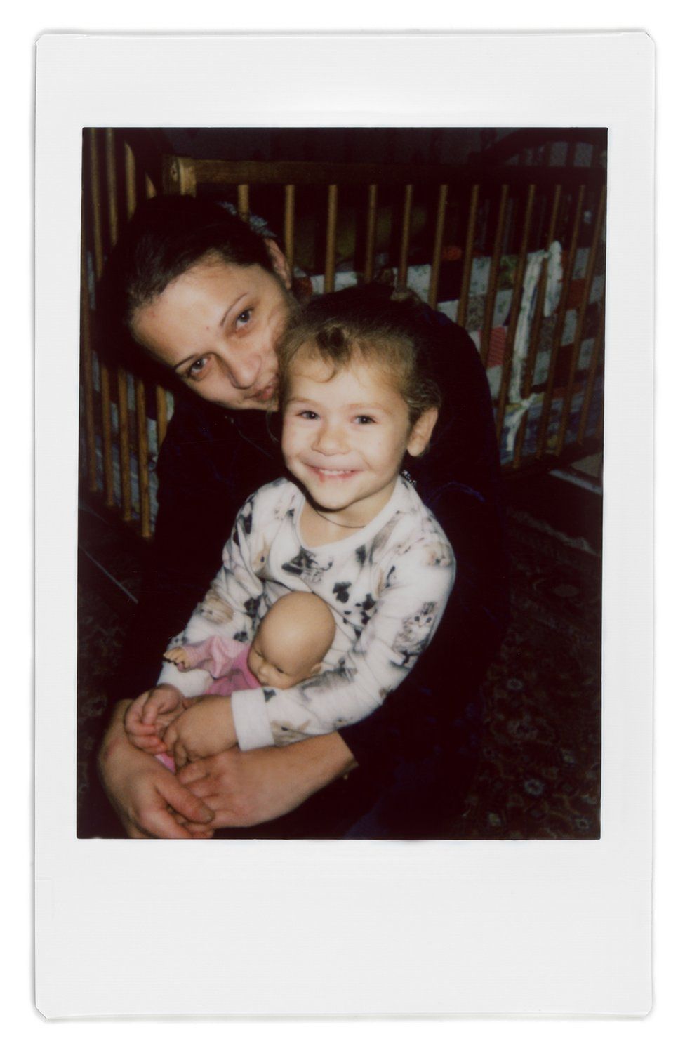A polaroid photo of Ana and her daughter