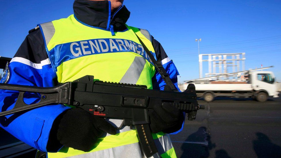 An armed French gendarme - one of a group checking vehicles and verifying the identity of travellers on the A2 motorway between Paris and Brussels, 25 January 2016.