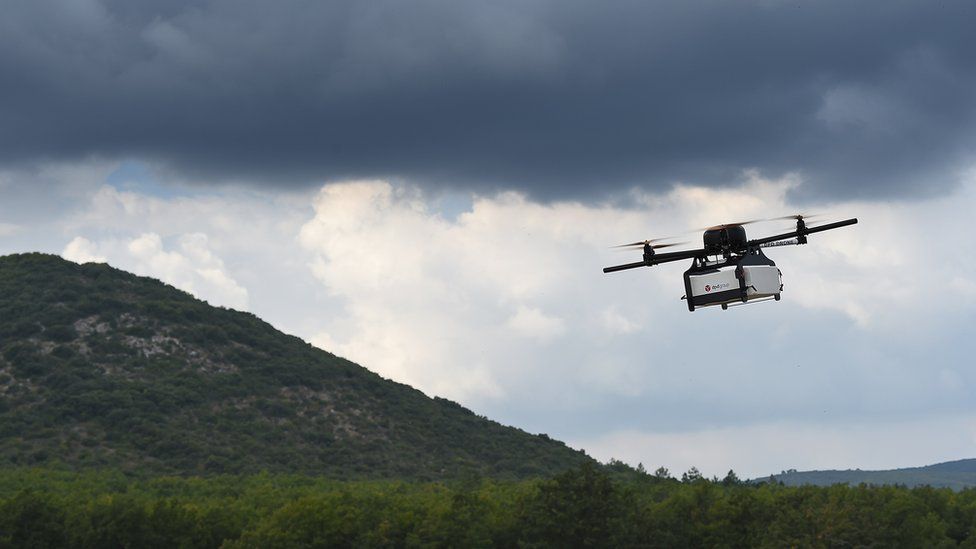 This picture taken on September 28, 2015 shows a Geopost drone flying in Pourrieres, southeastern France, during a presentation of a prototype of a package delivery drone.