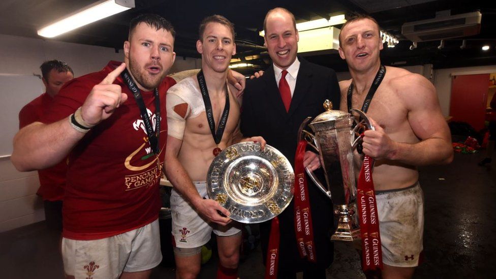 Prince William celebrates with with Rob Evans, Liam Williams and Hadleigh Parkes after the game