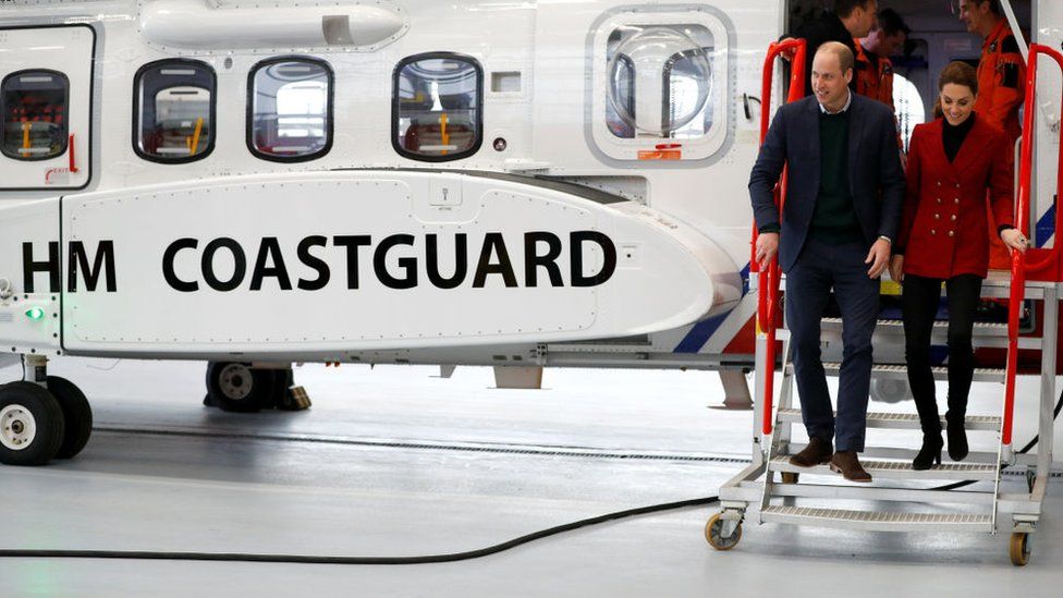 Duke and Duchess of Cambridge walk off a Coastguard helicopter