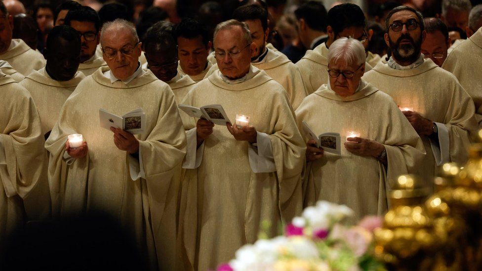 Clergymen attend the Holy Mass to Easter Vigil