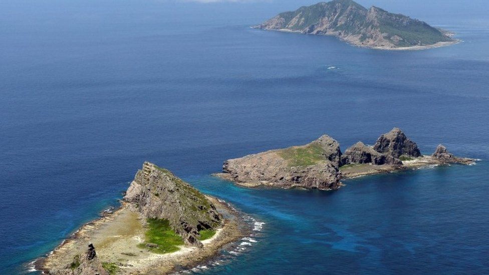 A group of disputed islands, Uotsuri island (top), Minamikojima (bottom) and Kitakojima, known as Senkaku in Japan and Diaoyu in China is seen in the East China Sea, in this photo taken by Kyodo September 2012.