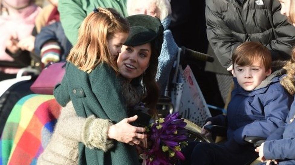 The Duchess of Cambridge and Princess Charlotte meet well wishers