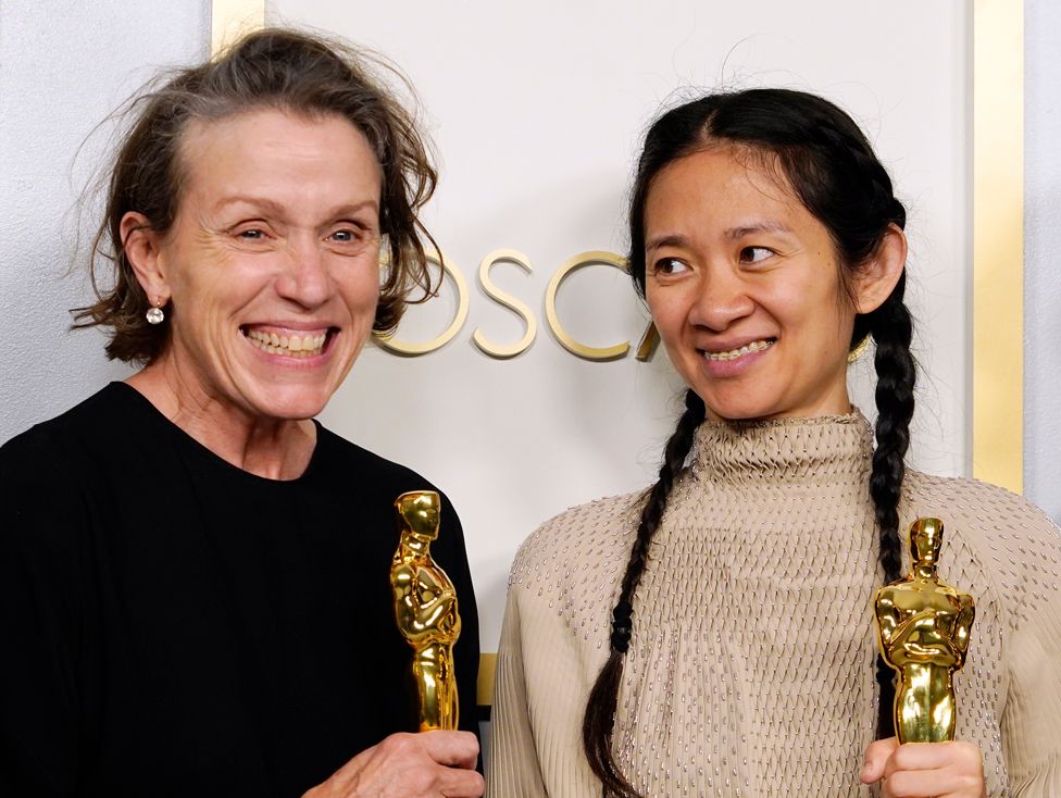 Frances McDormand and Chloe Zhao pose in the press room at the Oscars on 25 April 2021, in Los Angeles