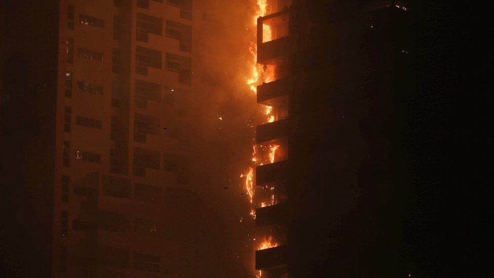 Fire and smoke billow from a high-rise building in Ajman, United Arab Emirates, early Tuesday, March 29, 2016