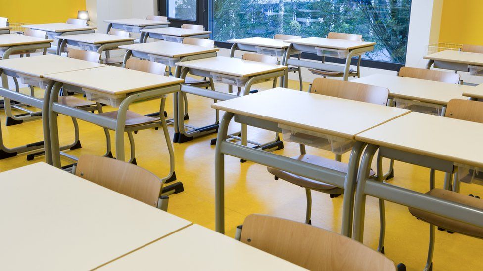 An empty classroom with rows of empty seats is seen in this file photo