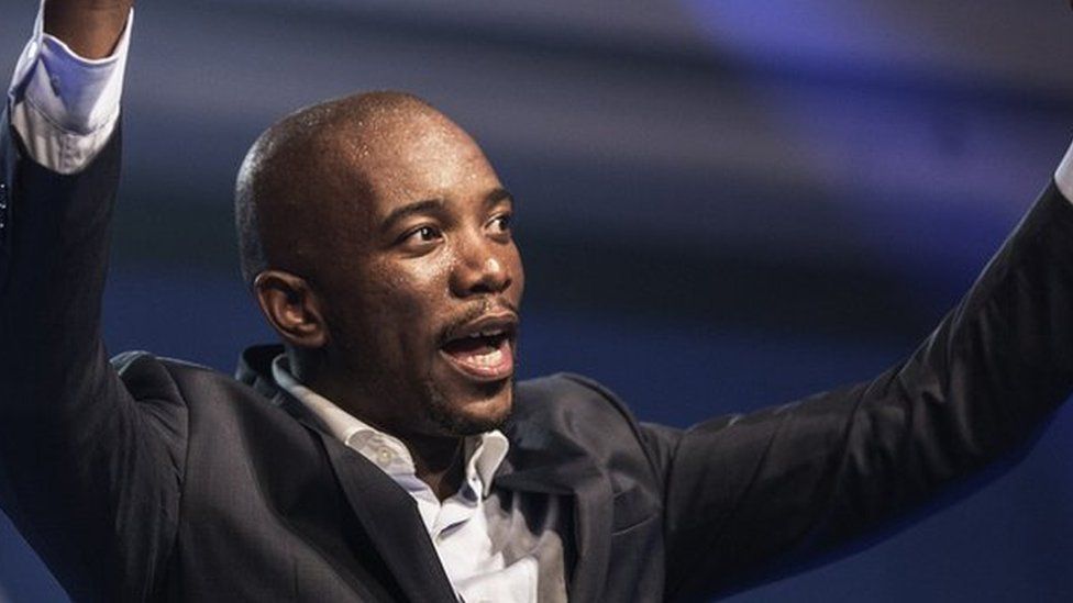 Mmusi Maimane, the newly elected leader of South Africa's main opposition Democratic Alliance (DA) party, gestures as he gives his maiden speech following his election in Port Elizabeth, South Africa, on May 10, 2015