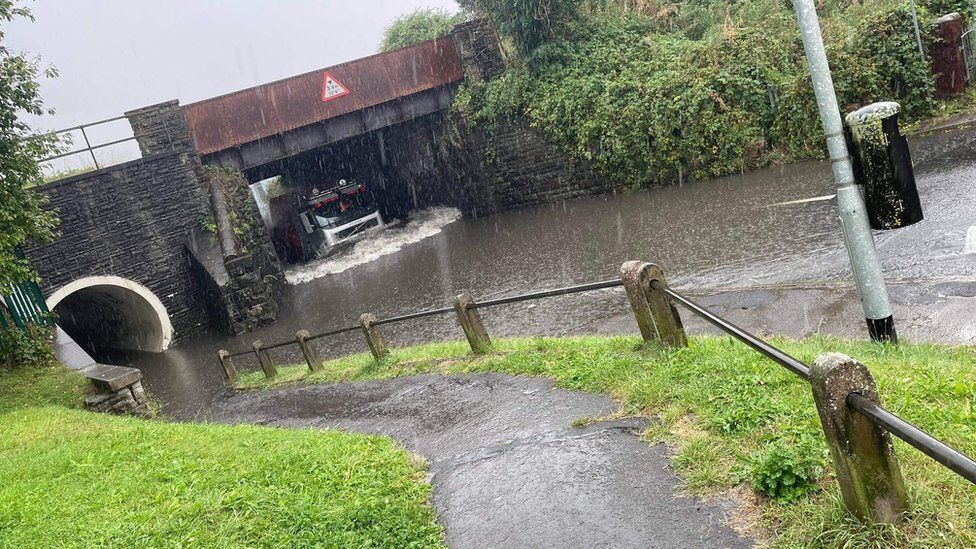 Flooded road under bridge
