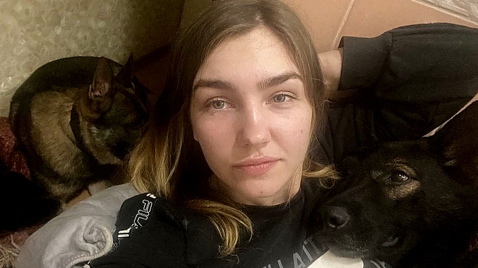 Oleksandra sheltering with her dogs in her flat's bathroom in Kharkiv