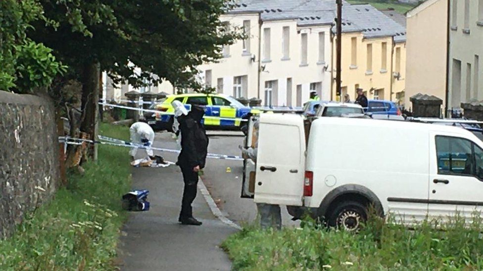 Officers examining the scene