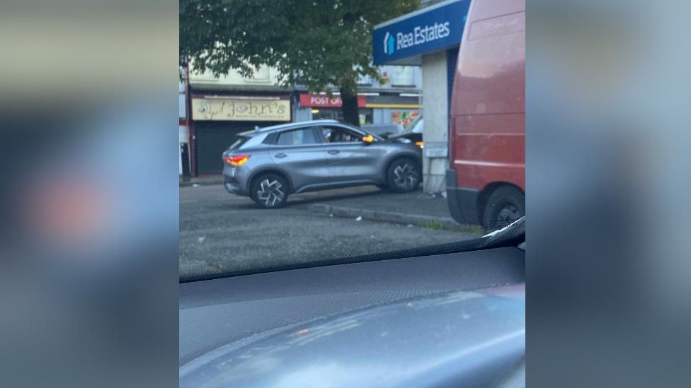 Silver car rammed into Rea Estate agents in Woodvale Belfast