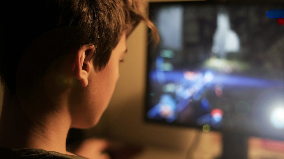 boy playing video game