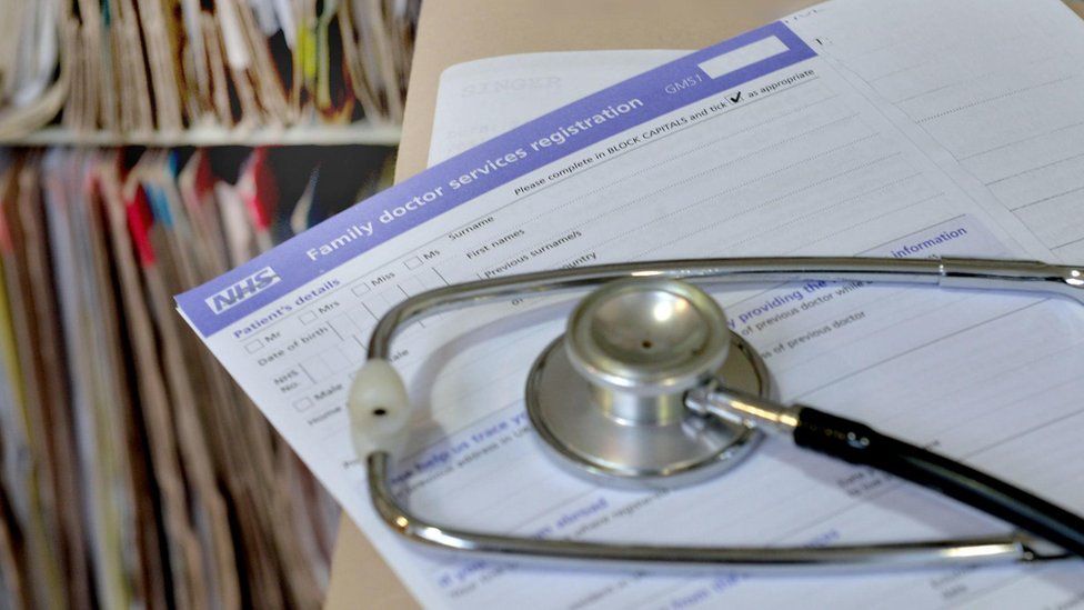 Stethoscope on top of NHS paperwork