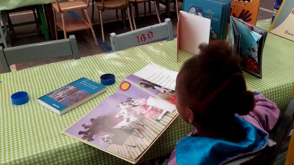 A child reading at the Cafemin migrant centre in Mexico City