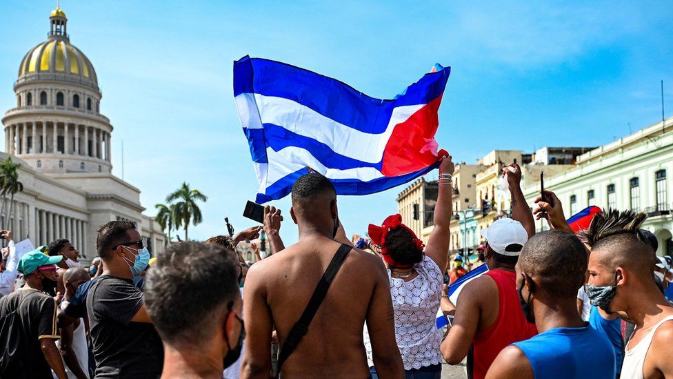 Cubans are seen outside Havana's Capitol during a demonstration against the government on 11 July 2021