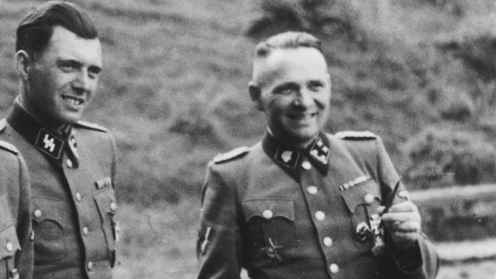 A black and white picture of Josef Mengele and Rudolf Höss in their uniforms
