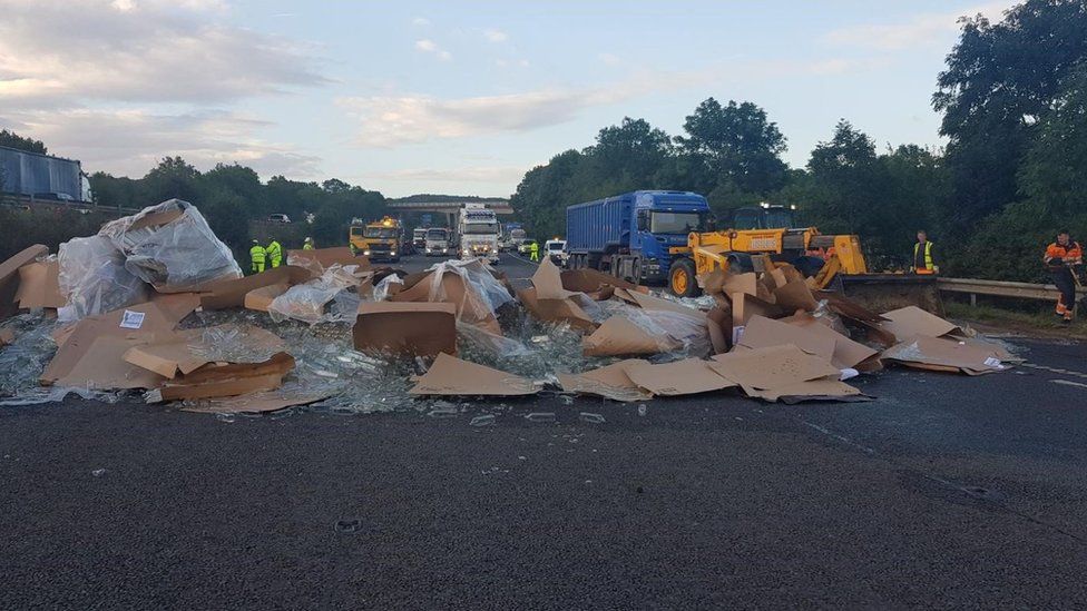 Glass and debris from the overturned lorry