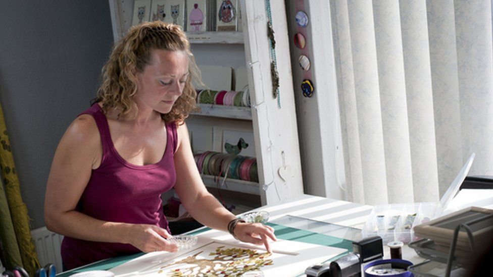 A woman making crafts
