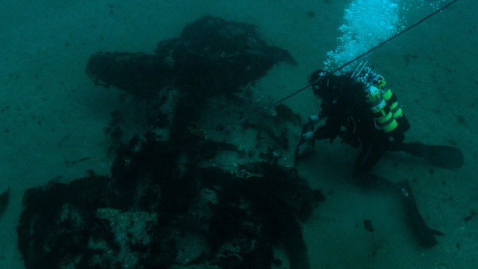 A diver at the site of the HMS Drake wreck