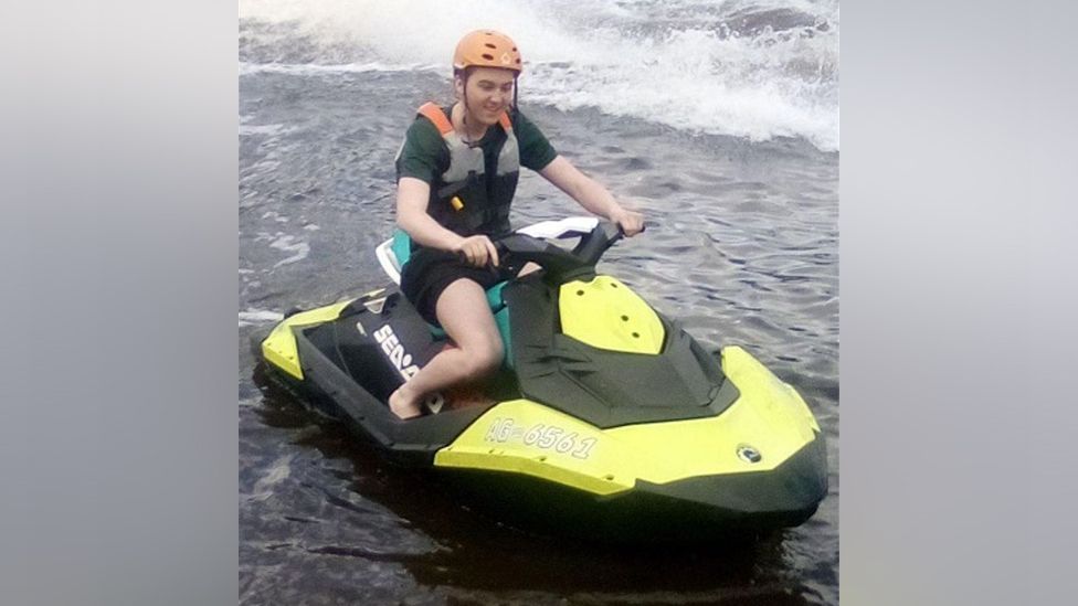 Ellis Cox riding a personal watercraft