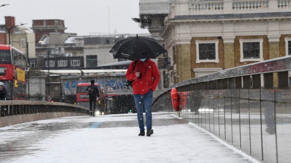 Person walks across London Bridge