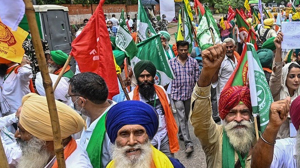 Protesting farmers stage a demonstration against the central government's recent agricultural reforms in New Delhi on July 22, 2021.