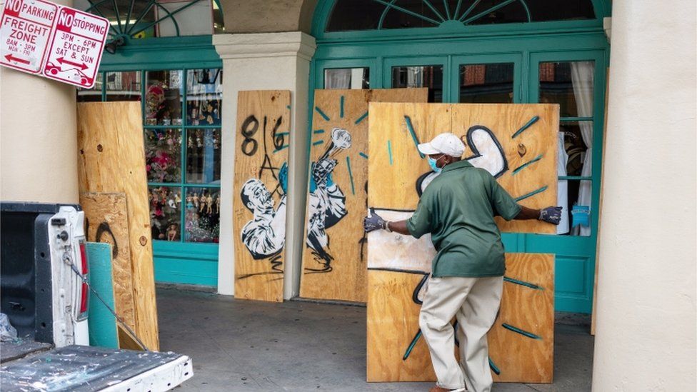City of New Orleans worker Louis Marrero boards up businesses in the French Quarter as the city braces for the arrival of Tropical Storm Sally in New Orleans, Louisiana, U.S., September 14, 2020