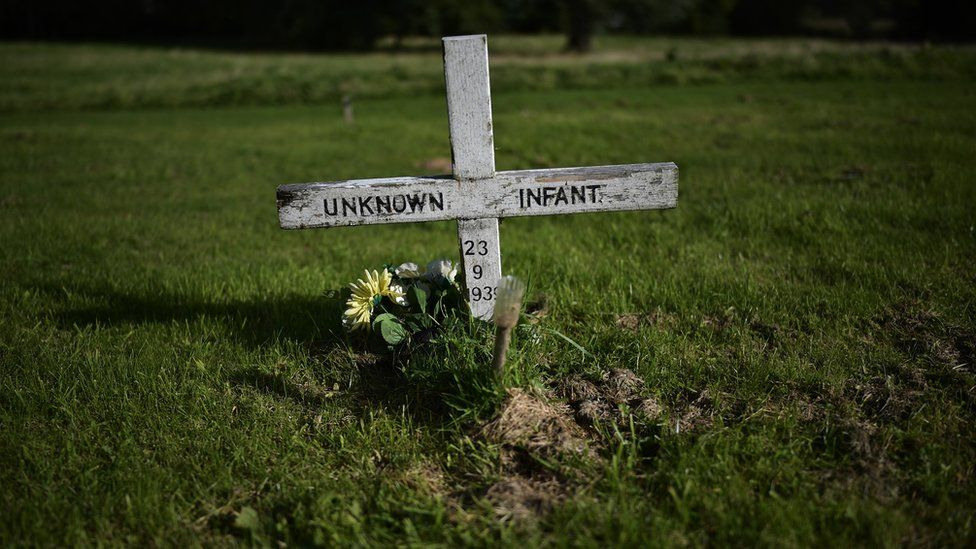 A headstone which reads unknown infant can be seen in the Bog Meadows area of Milltown cemetery