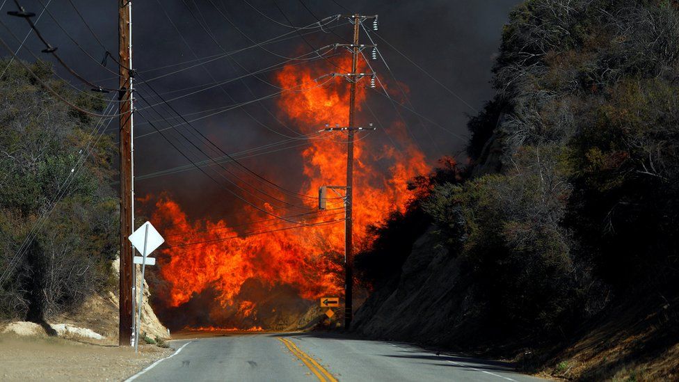 Flames from a wildfire are seen in Calabasas, California