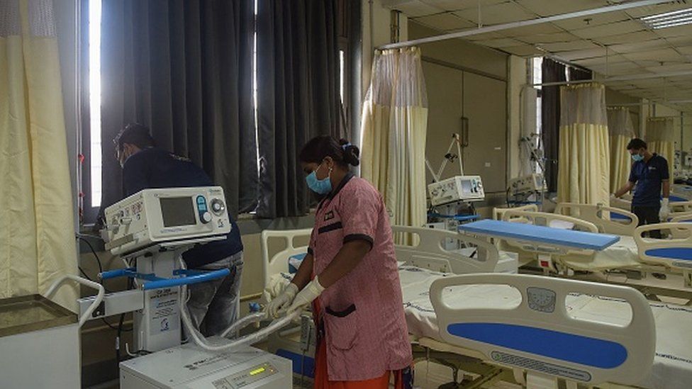 Hospital staff checks the health monitoring devices installed in a Covid-19 coronavirus ward of a Civil hospital in Ahmedabad on December 6, 2021.