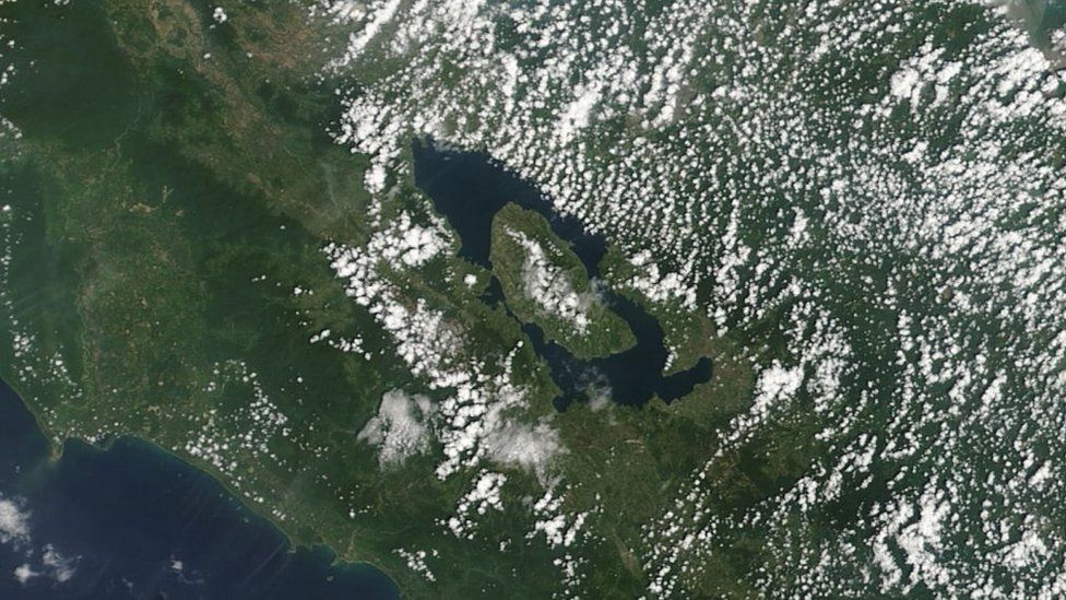 Satellite image of a long oval lake with a central island