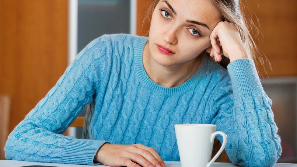 Bored woman waiting for call