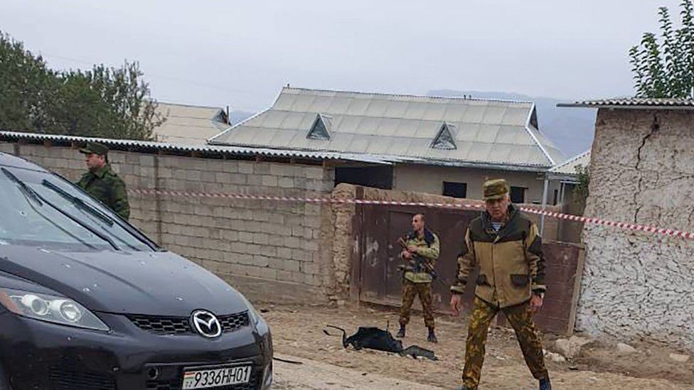 Security officials cordon off the site of the attack in Tajikistan