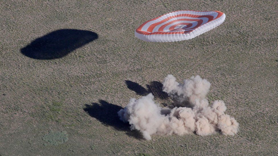The Soyuz capsule lands in a cloud of dust. 3 June 2018