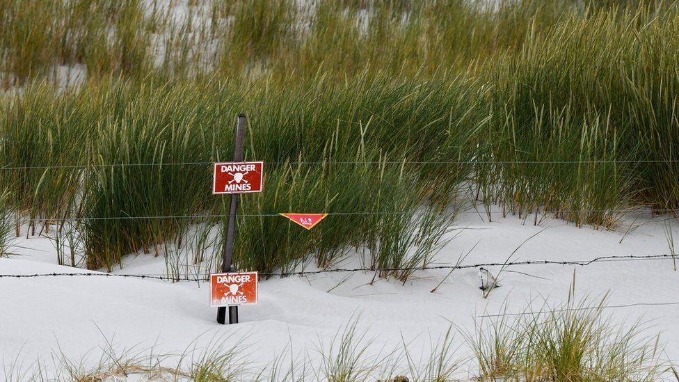 Yorke Beach with mine warning signs