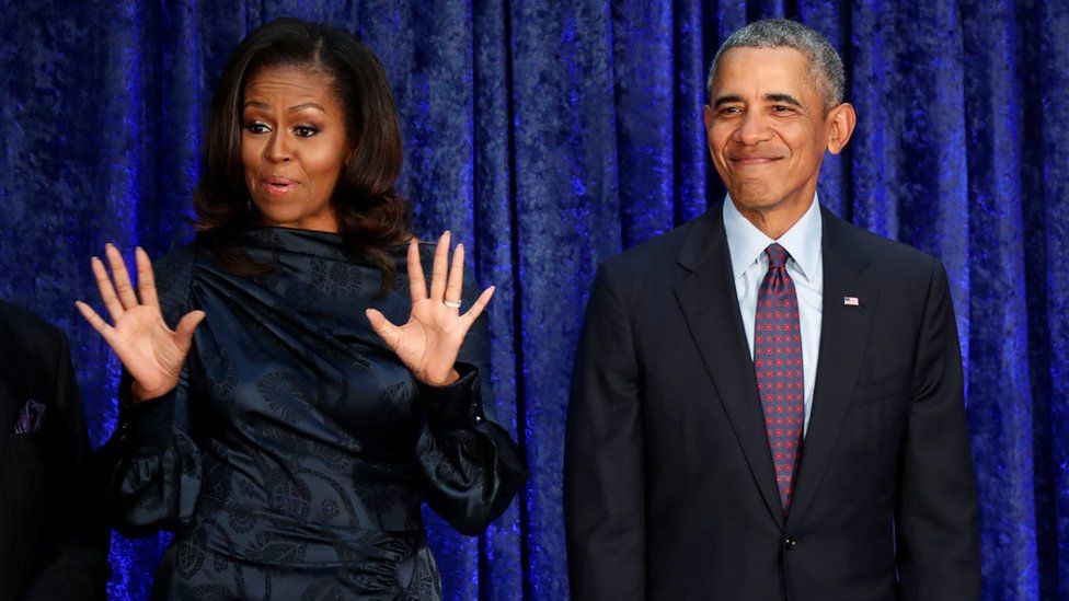 Former US President Barack Obama and former First Lady Michelle Obama react as their portraits are unveiled at Smithsonian's National Portrait Gallery in Washington in February 2018