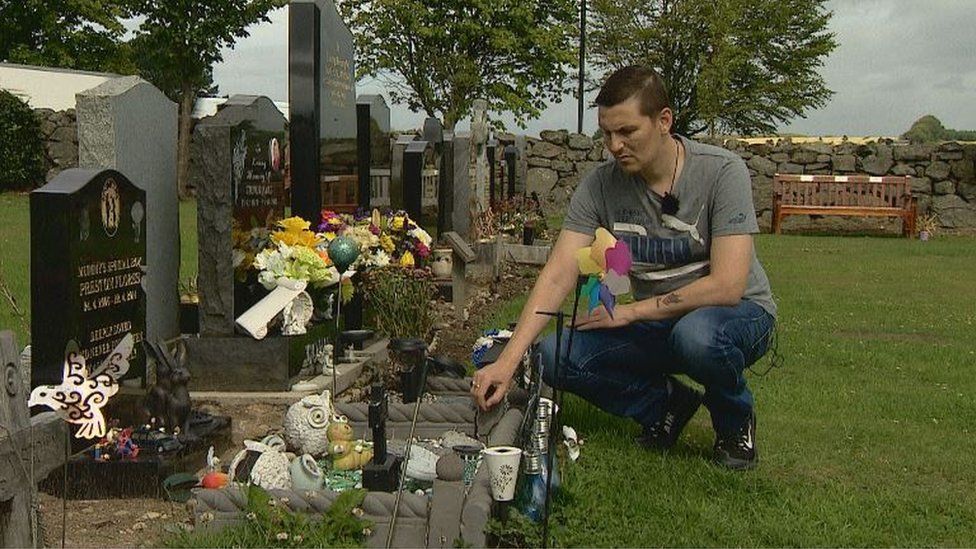 Keith Will at son's grave