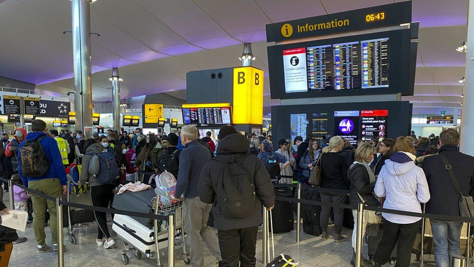 Queuing people at Heathrow Airport