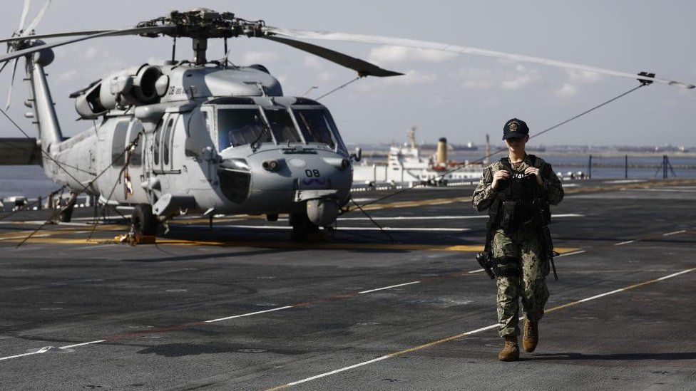 File photo of an armed US navy sailor patrolling a port in Manila, the Philippines 17,600 troops