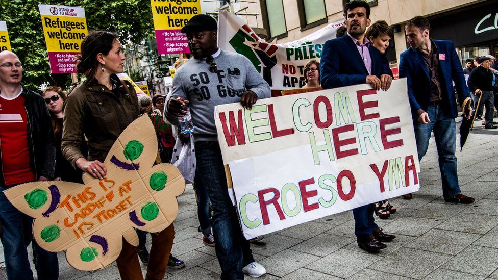 A 'refugees welcome' march in Cardiff; the area is one of four that currently house asylum seekers in Wales